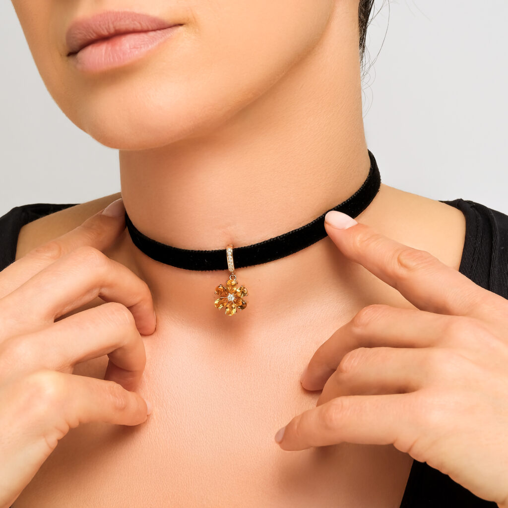 Amber Sun Pendant — natural citrine petals with a center diamond, rose gold, worn on neck