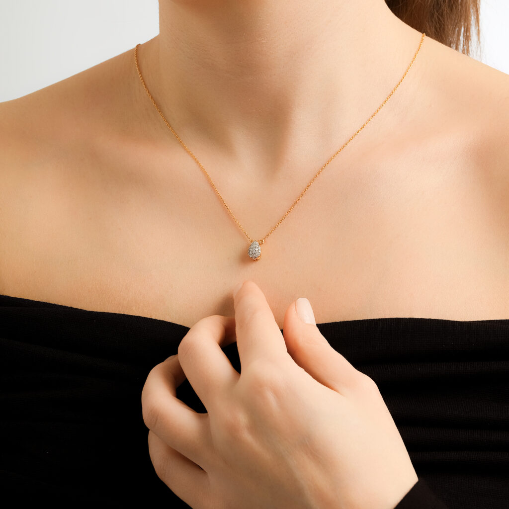 Damla Solitaire Necklace — pavé diamond drop on a rose gold chain, worn on neck