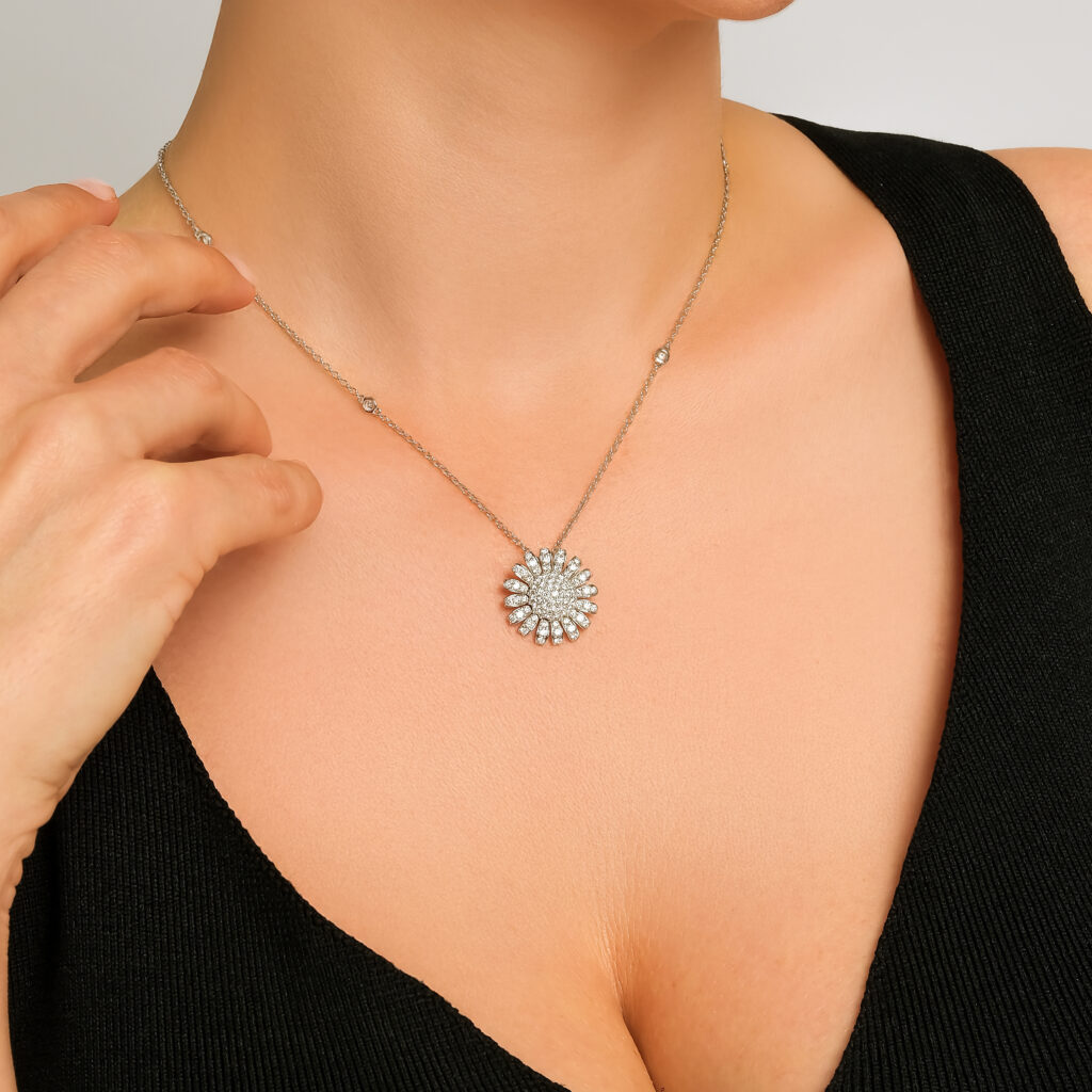 Güneş Bloom Necklace — sunburst of diamonds on a white gold chain, worn on neck