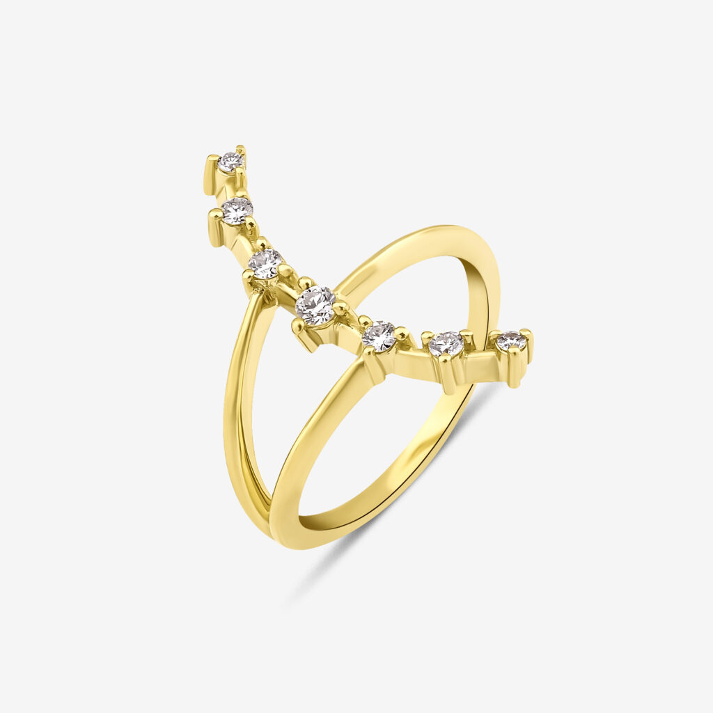 Kuyruklu Star Ring — brilliant diamonds tracing a shooting star silhouette, yellow gold, side view