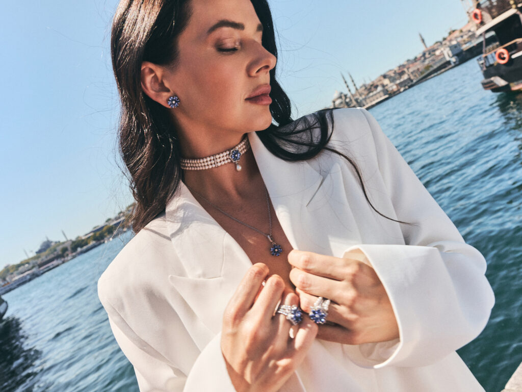 Jelena wearing an Ottoman Garden Collection, standing by the Bosphorus with the Istanbul skyline in the background