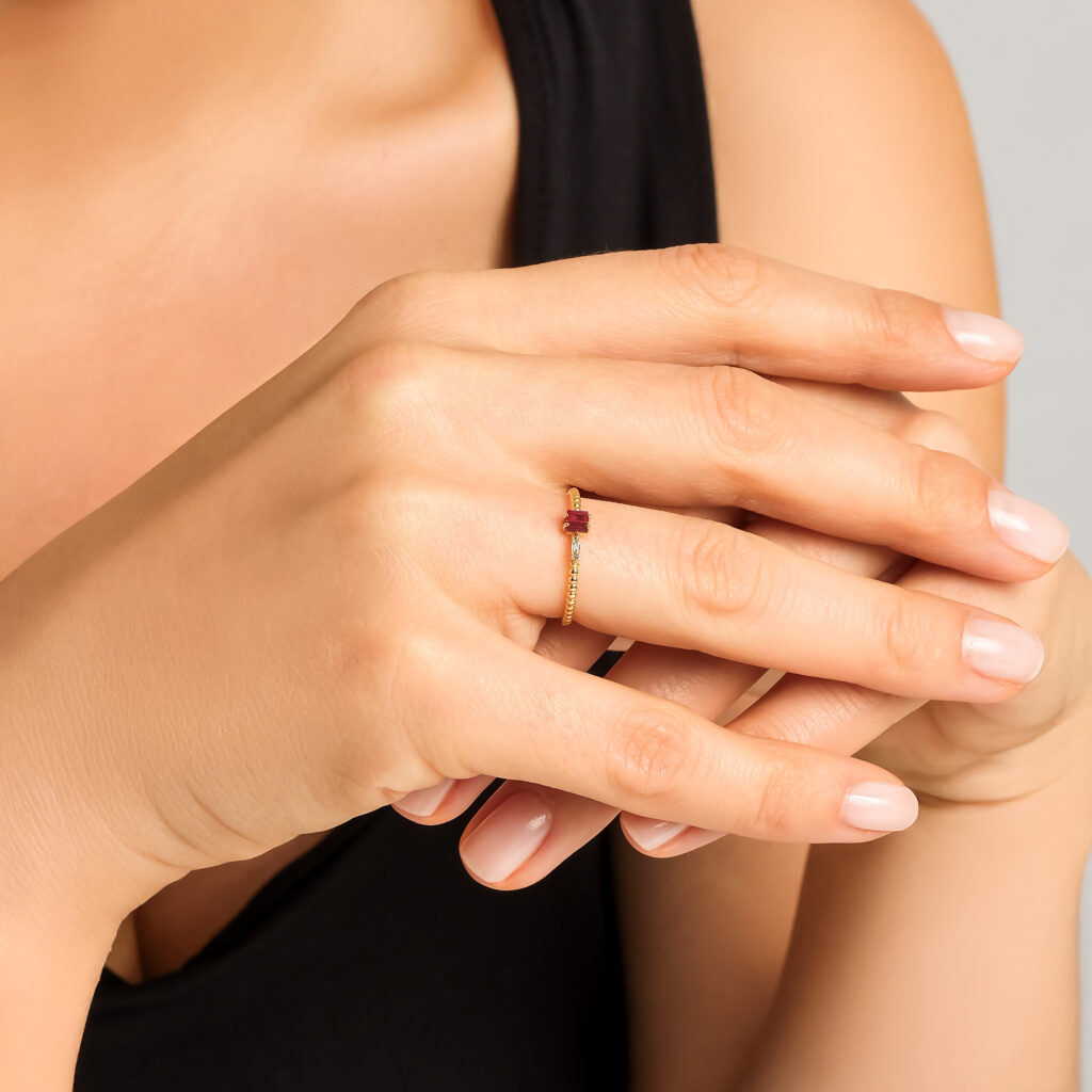 Ruby Ateş Ring — ruby and diamond on a twisted yellow gold band, worn on hand