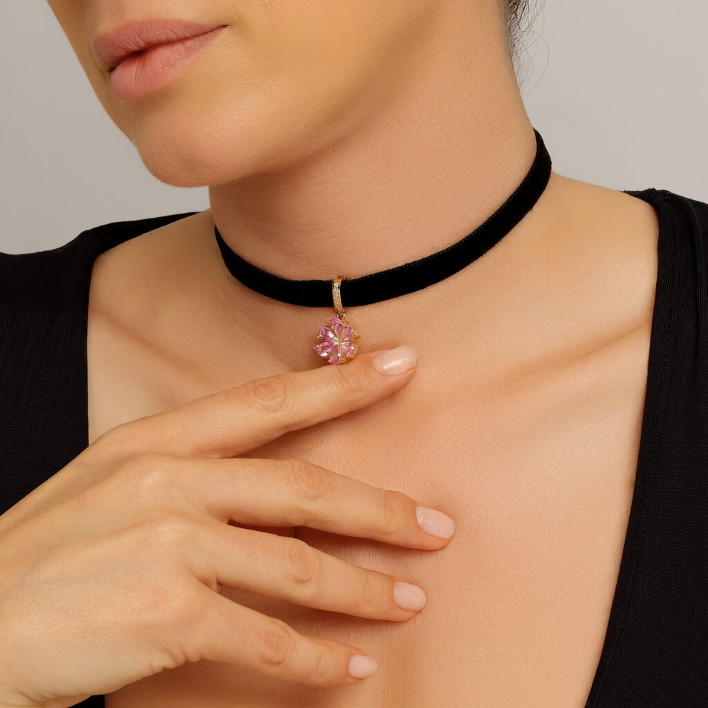 Sultana Rose Pendant — lab-created pink sapphire petals with a center diamond, yellow gold, worn on neck